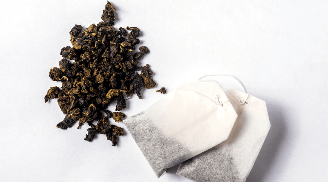Loose leaf tea next to some tea bags