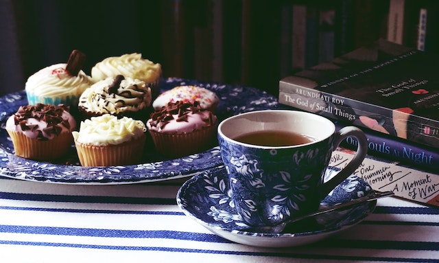 An Authentic Tea Food Pairing setup with tea and cupcakes