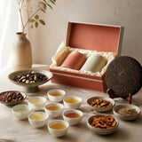 An abundant Vietnamese tea tasting spread with rare aged tea, botanicals and an open gift box